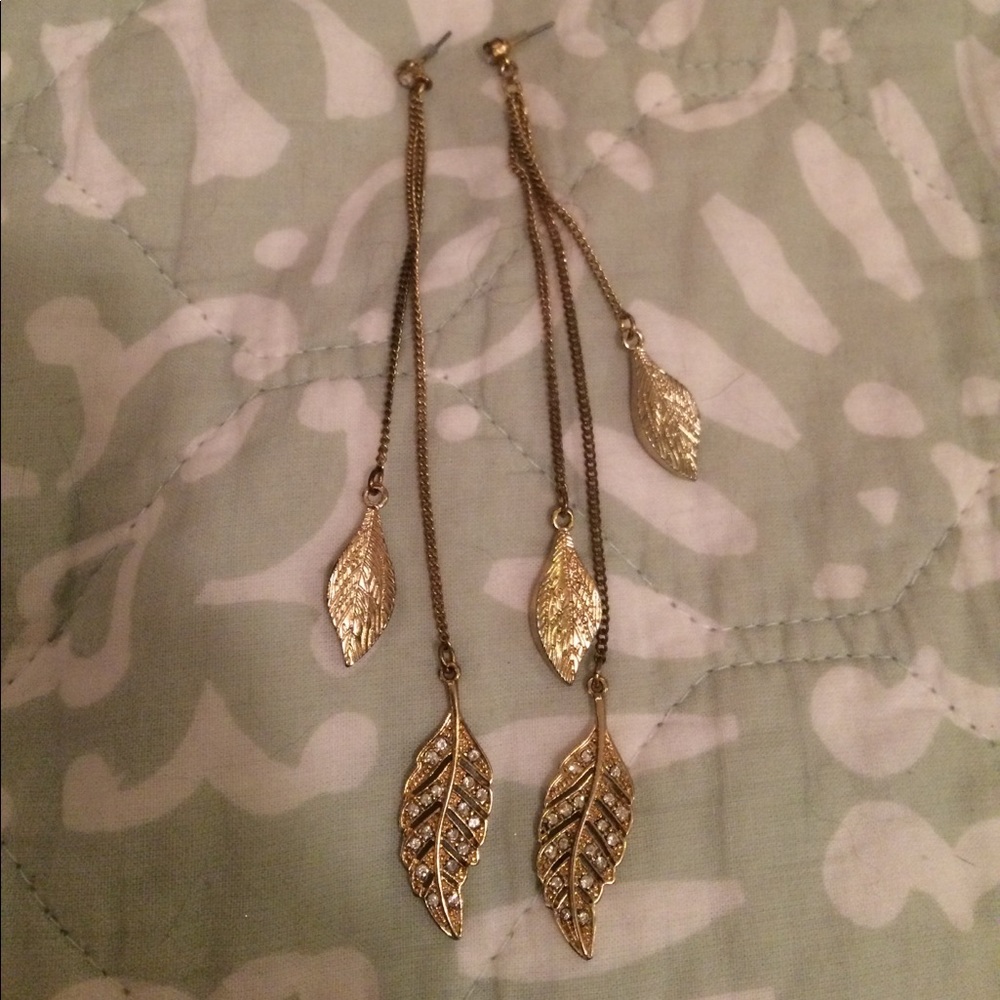 Gold leafy long earrings with rhinestones