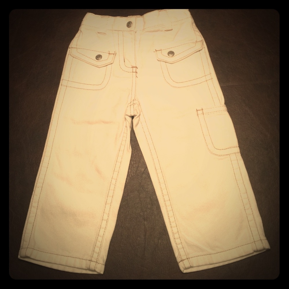 Hanna Andersson Ivory pants with tan stitching.