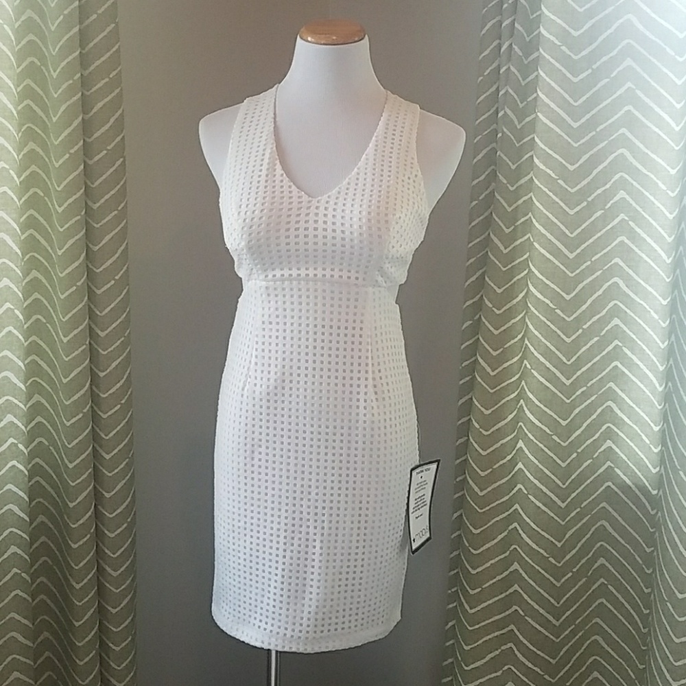 Gorgeous white mini dress NWT cutouts fully lined