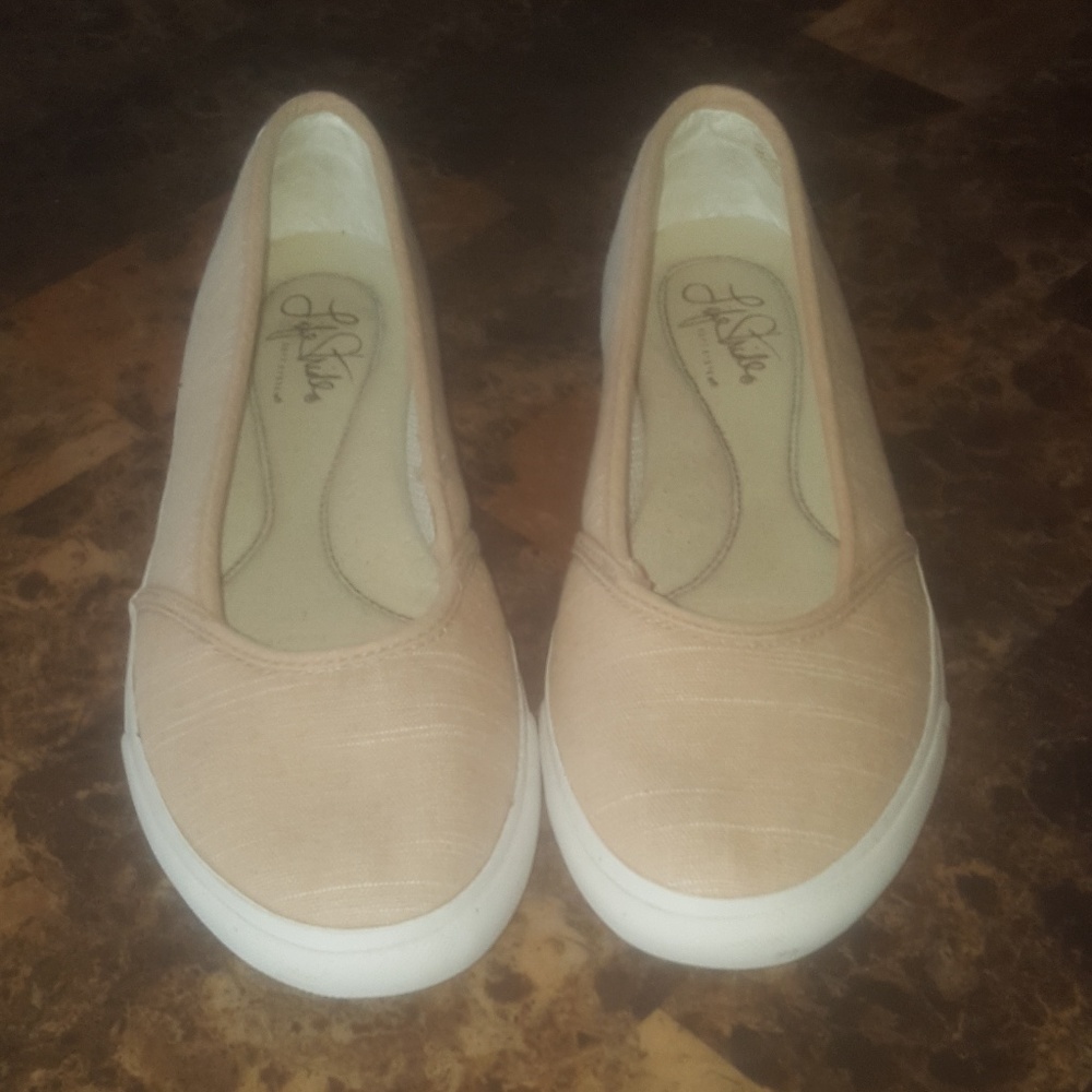 Tan and white flats
