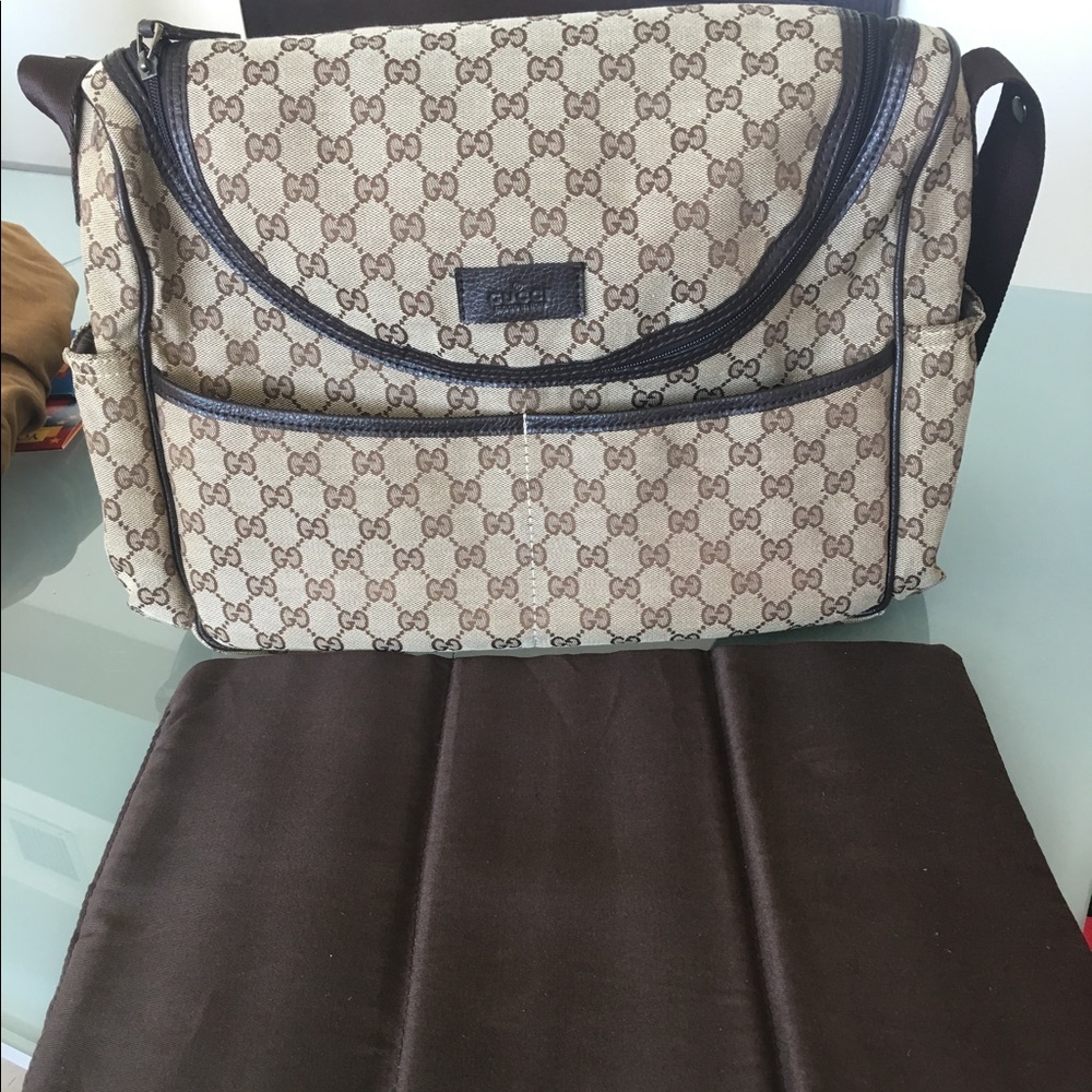 Diaper bag and baby carrier