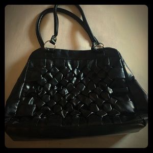 Black Hand Bag with purple interior.