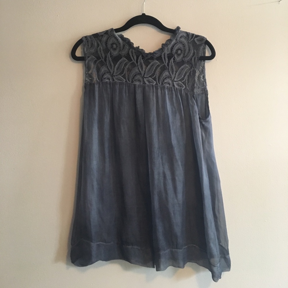 Blue tank top with lace around the top