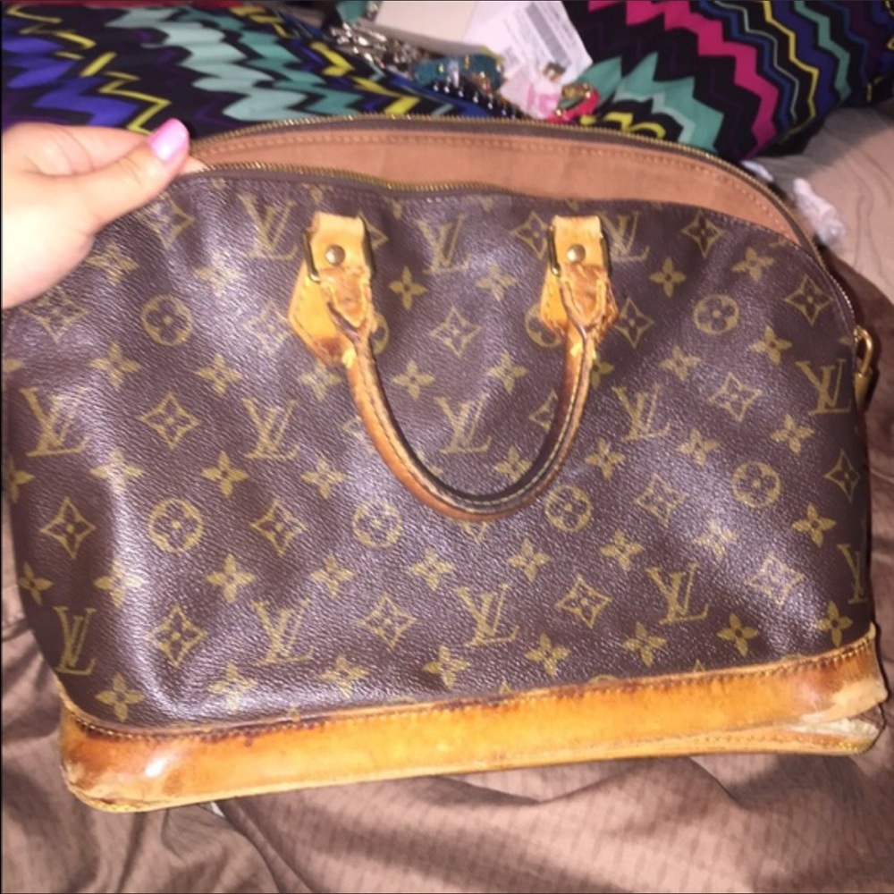 Authentic Louis Vuitton Alma Bag.  Needs repair.