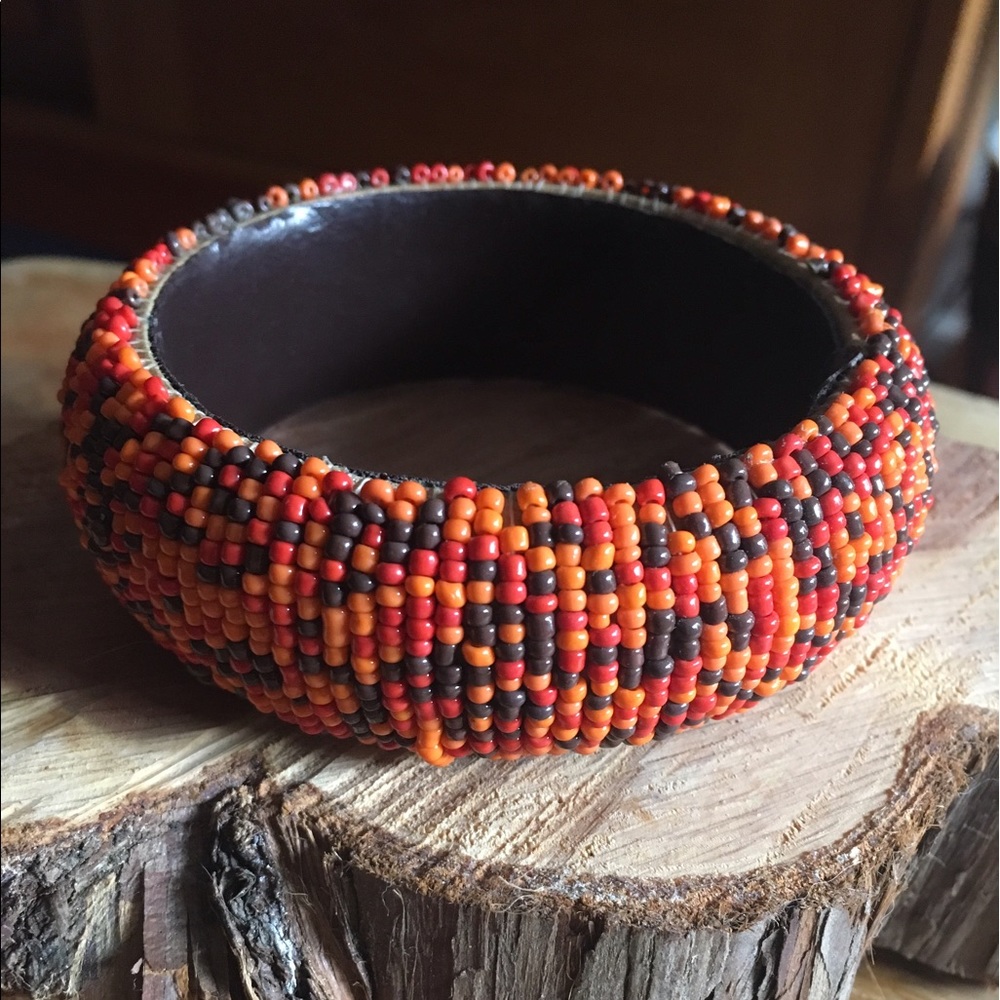 Red, orange, black beaded bracelet