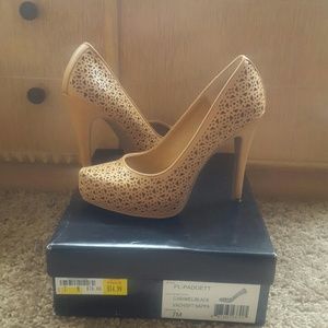 BCBG laser cut pumps