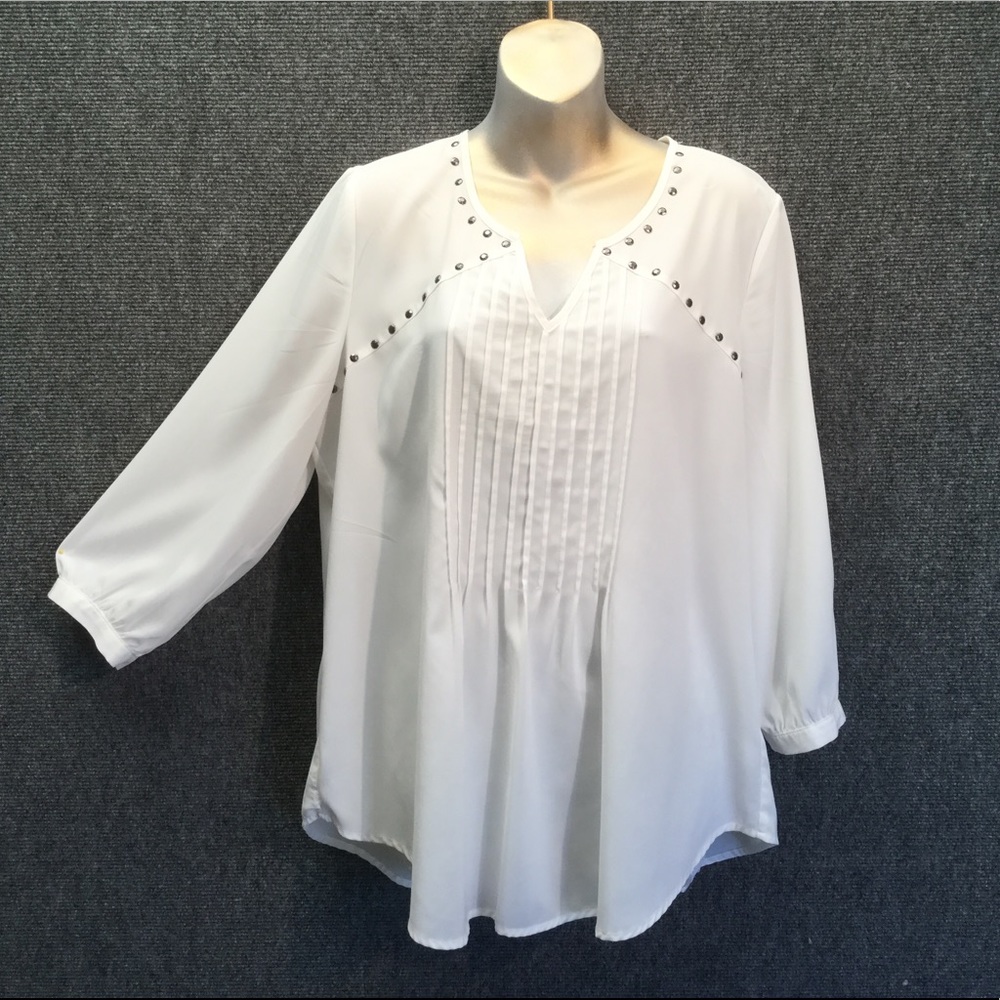 Creme sheer dressy long sleeve embellished top.