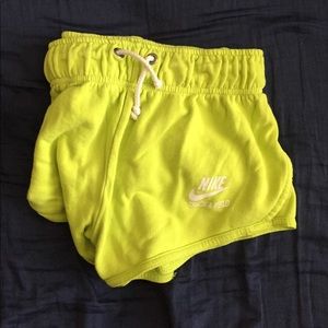Neon green Nike track and field shorts