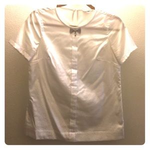 A white J-Crew top with rhinestone detail at neck