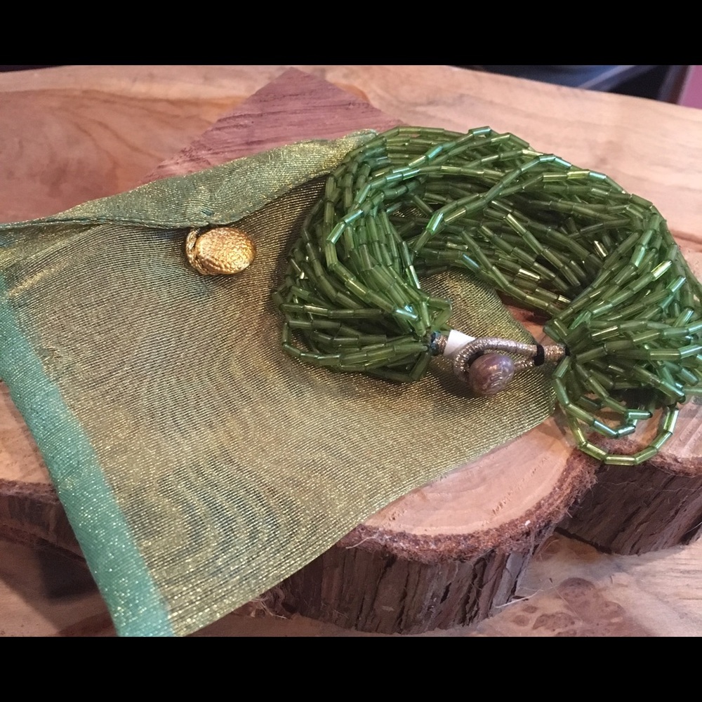Green beaded bracelet with organza bag