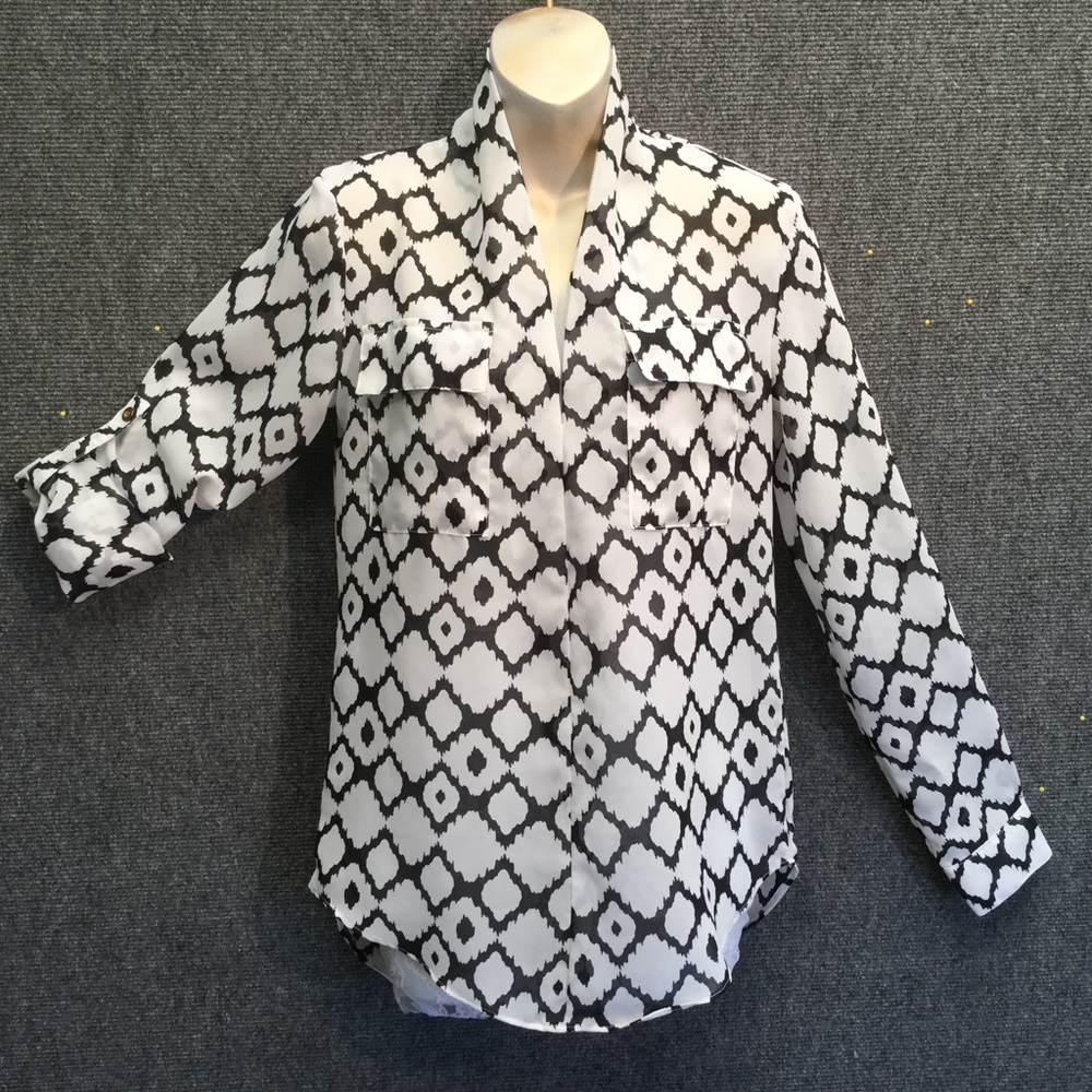 Striking creme, black pattern sheer poly blouse.