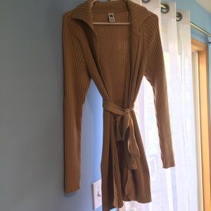 Long, tan belted sweater