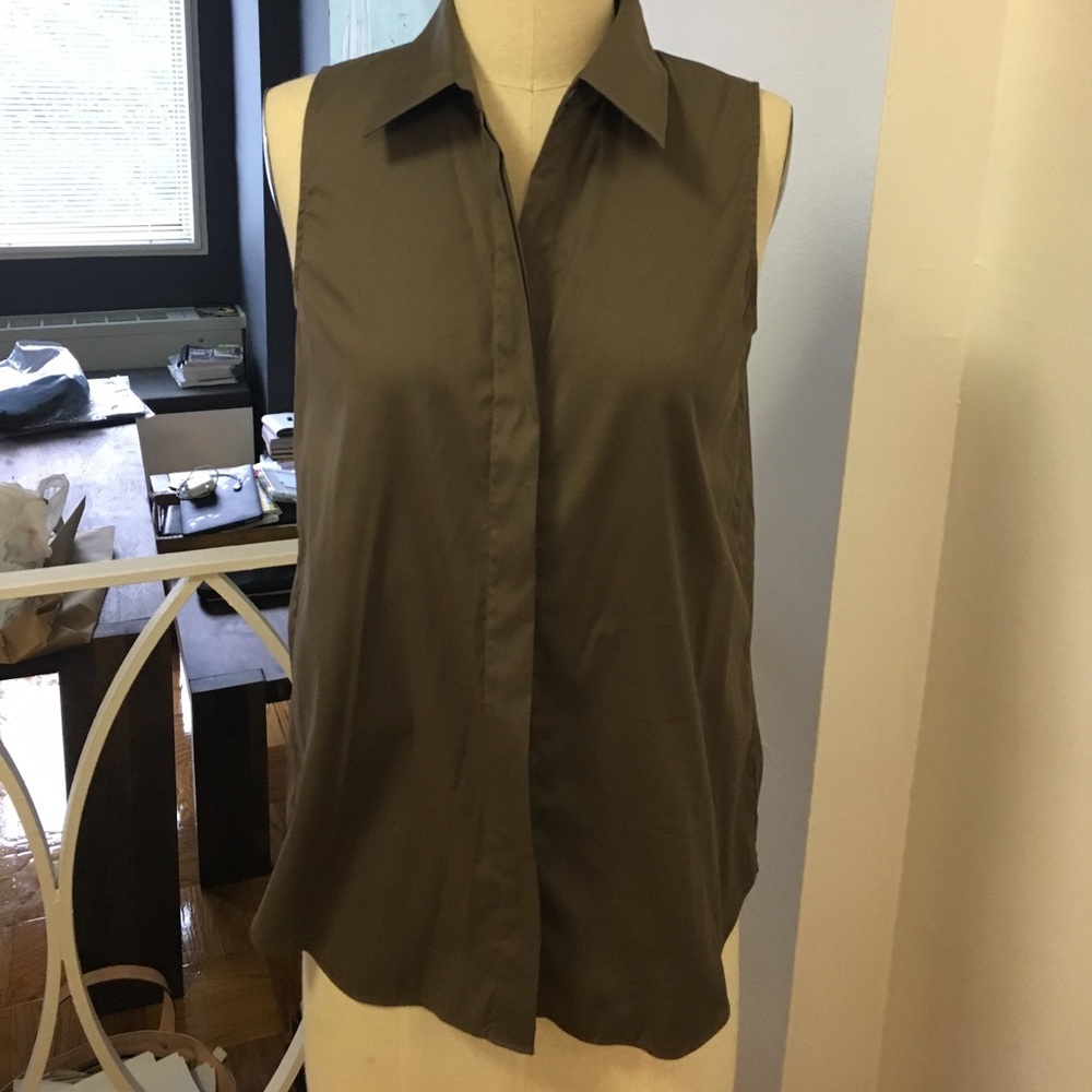 green sleeveless Theory top