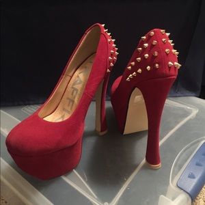 Red suede platform pumps