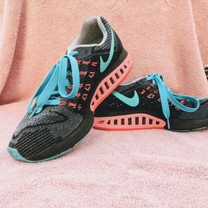Pink and blue nike zoom structure 18