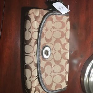 Coach large flip wrist