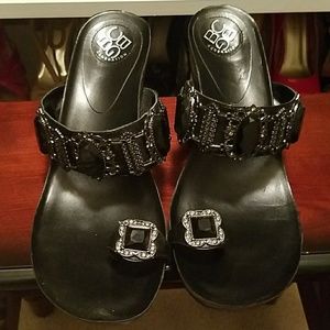 Black jeweled low heeled wedges