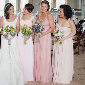 Long, pink bridesmaid dress with embellishments.