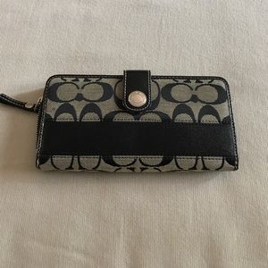 Black and cream Coach wallet