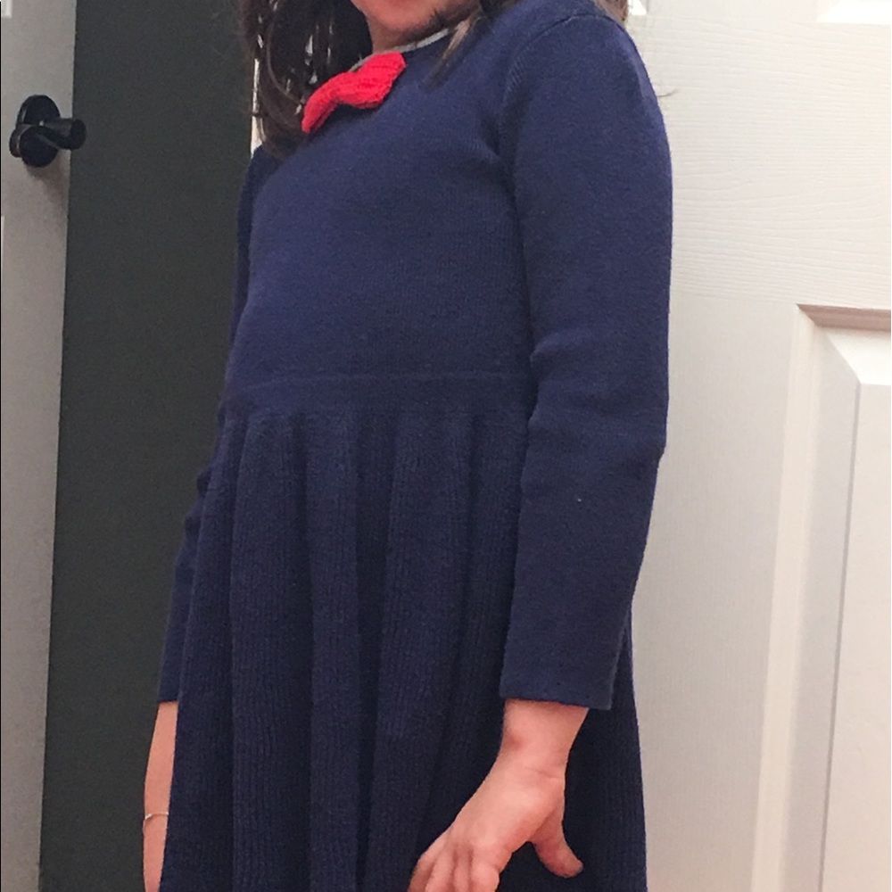 Beautiful blue dress with attached red bow tie.