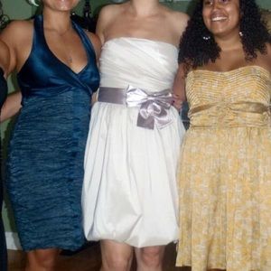 Knee length off-white wedding dress.