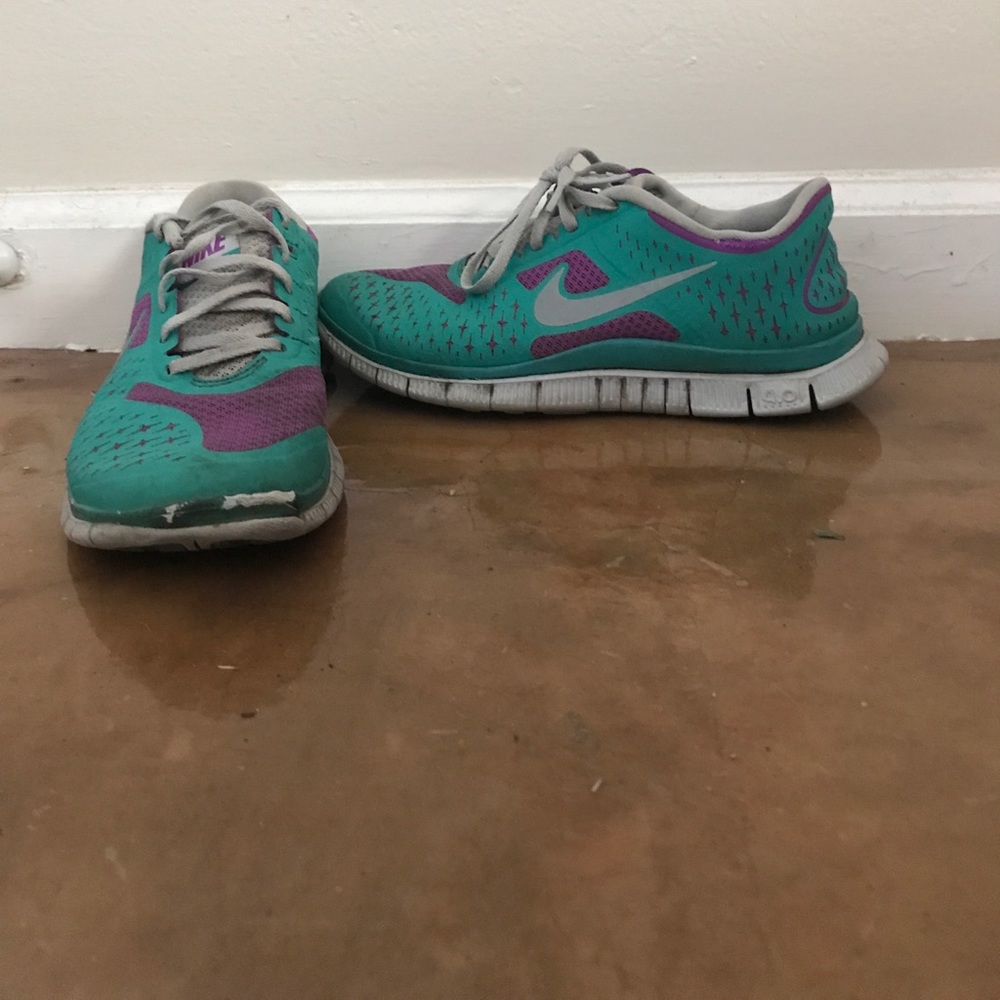 Teal and purple size 7 Nike running shoes