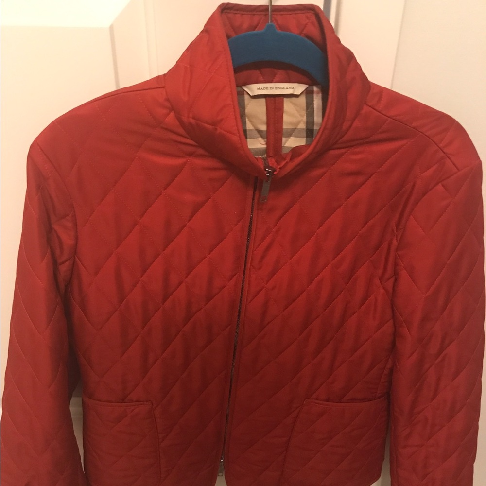 Burberry red quilted bomber jacket.