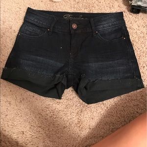 Dark washed denim shorts.