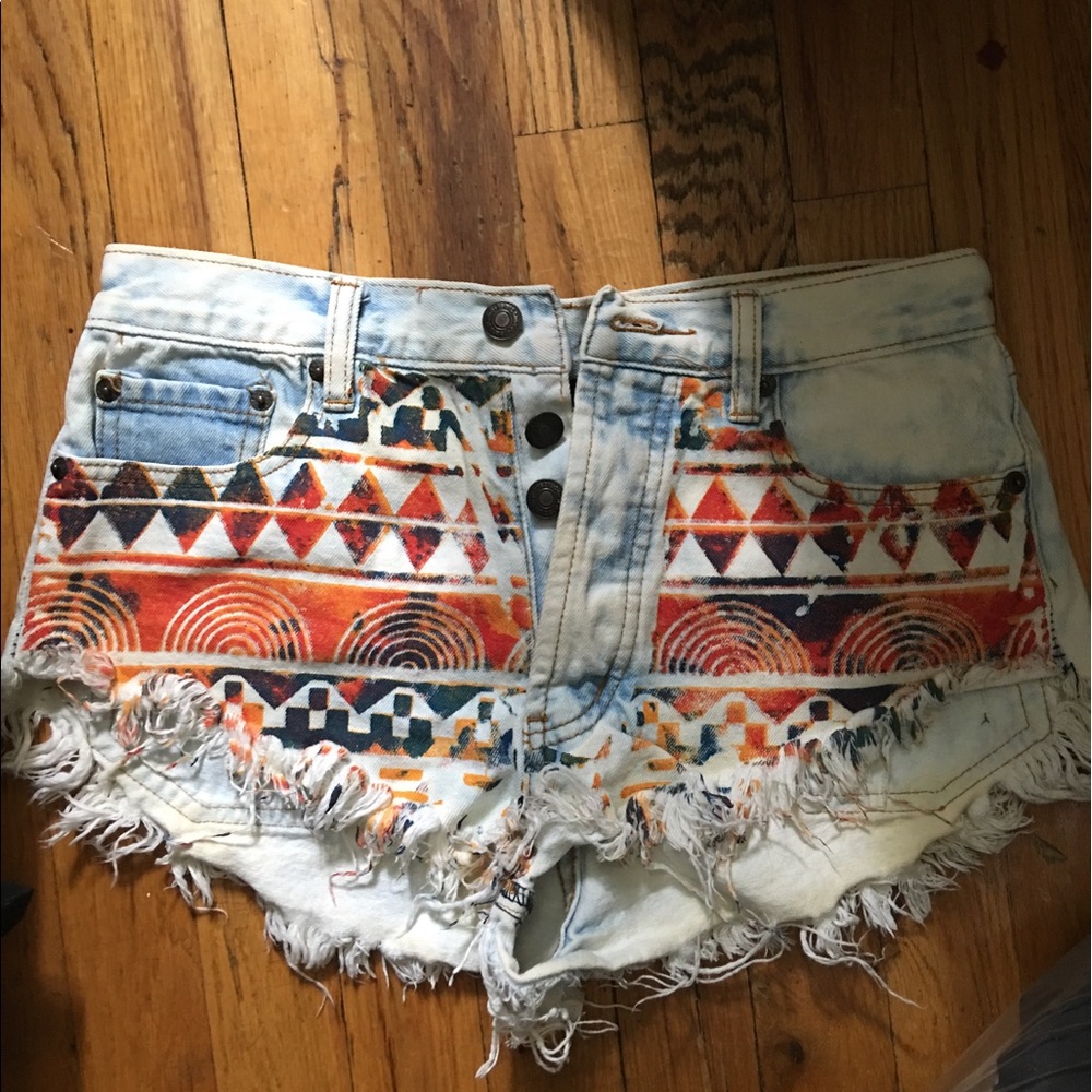 aztec/acid washed cheeky denim shorts
