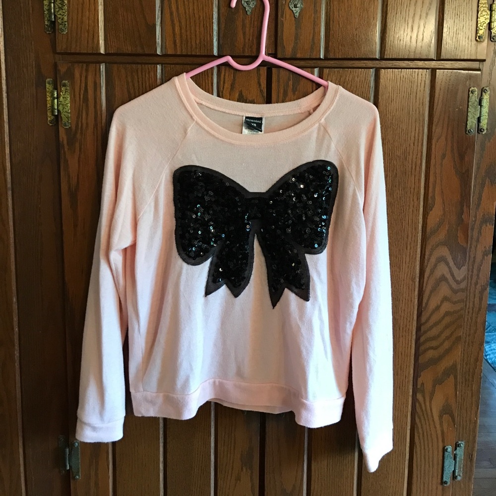 Super soft pink knit shirt with black sequin bow!