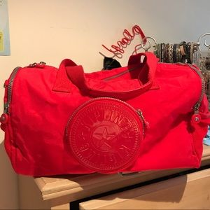 Small red Kipling duffel bag