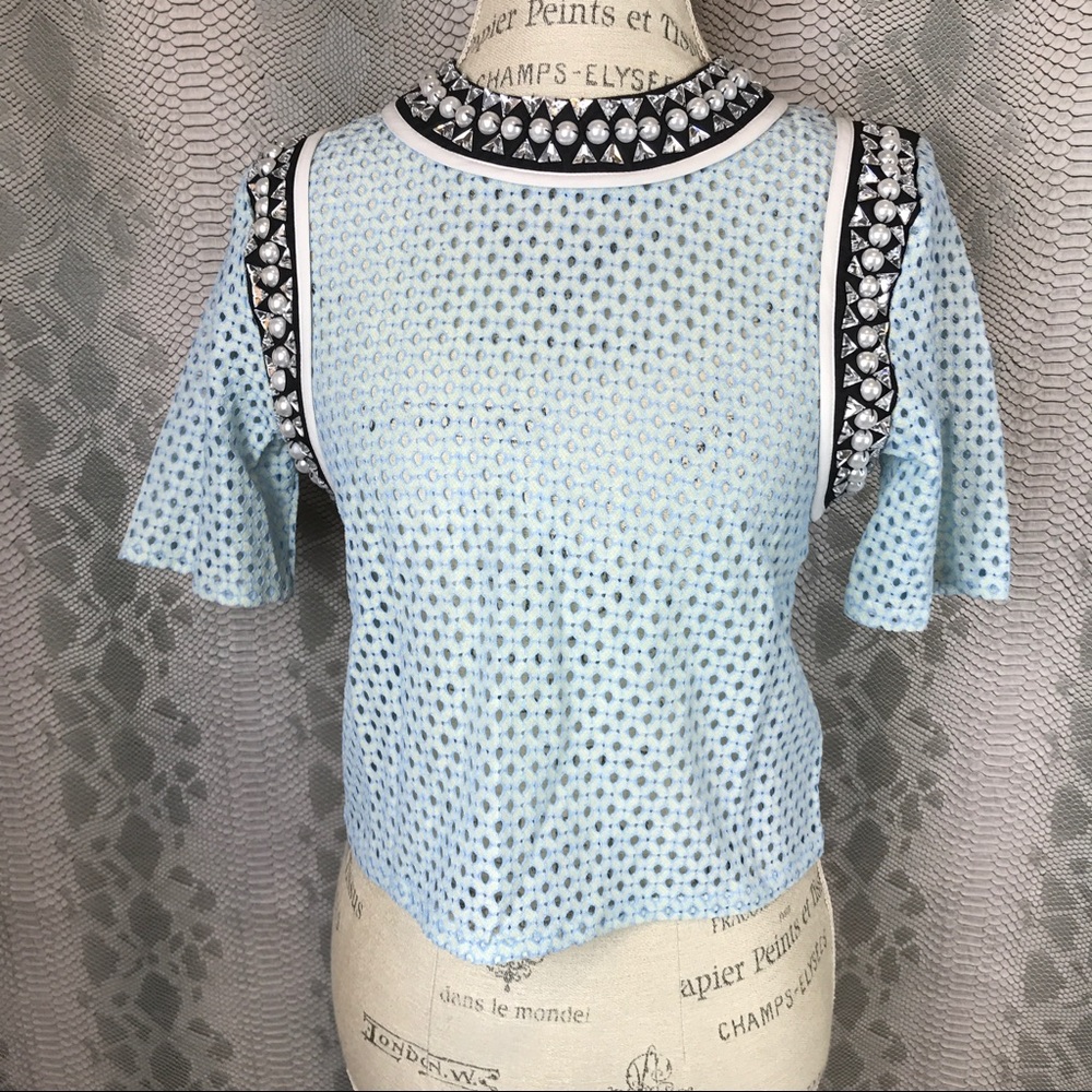 Blue cut out pearl stone blouse detail