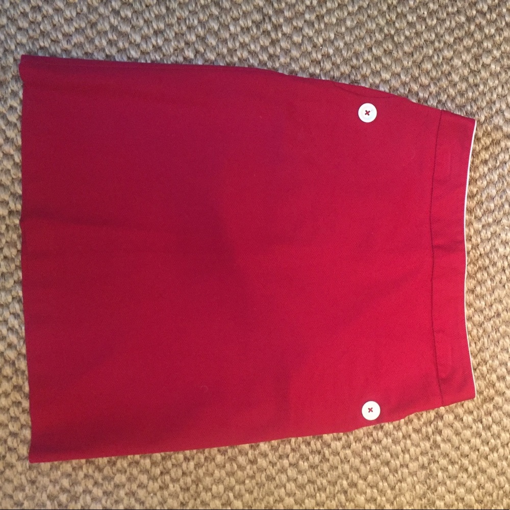 Red skirt with white buttons and trim