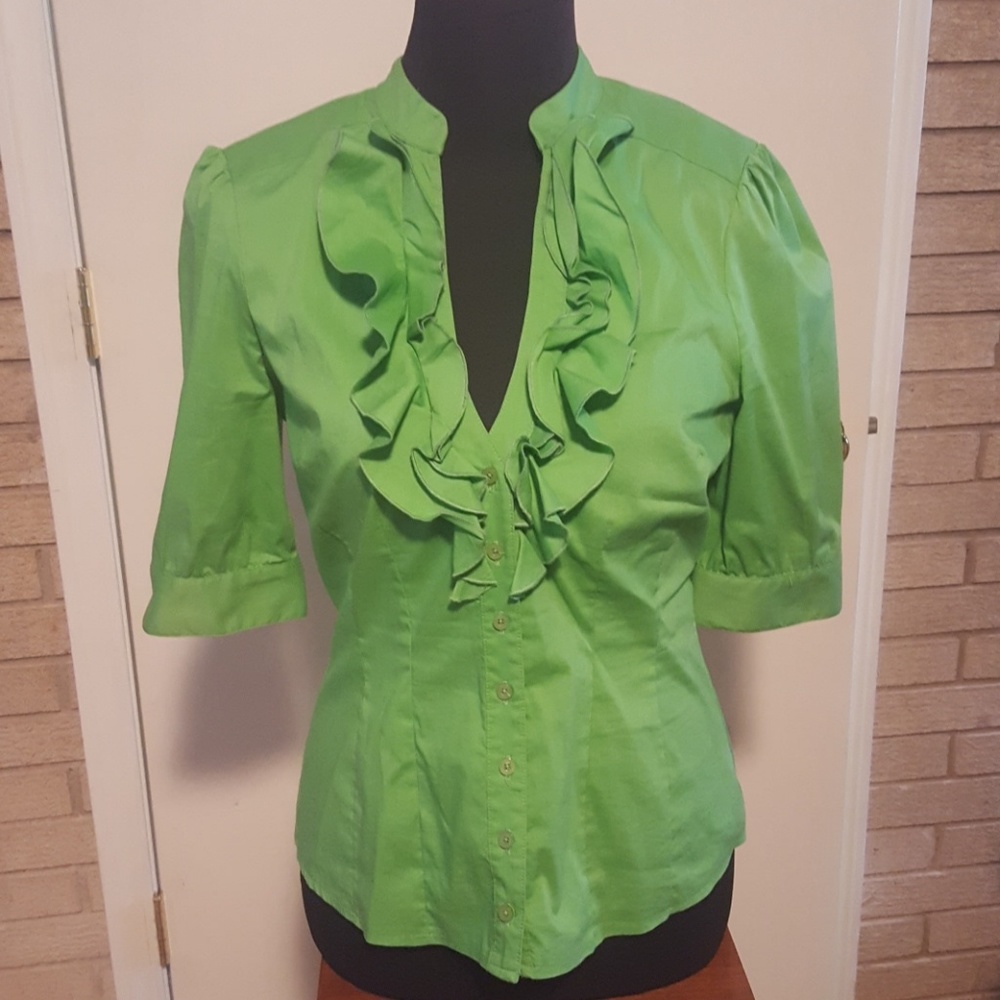 Vibrant green button down blouse by Bebe