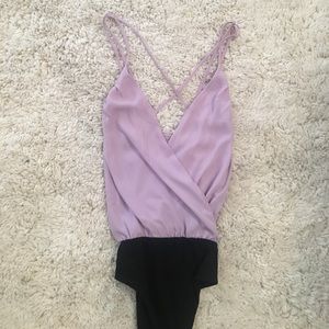 Purple cross body suit