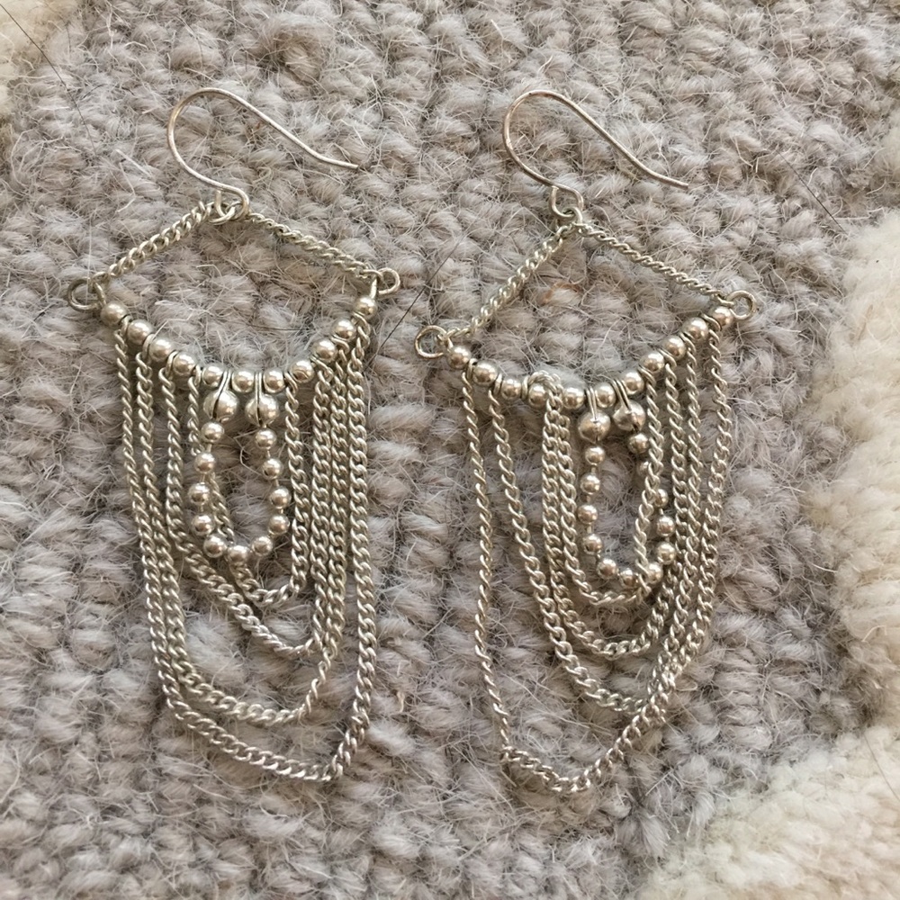 Silver earrings.