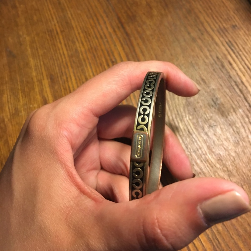 Coach gold bangle.