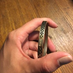 Coach gold bangle.