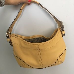 Small leather coach bag in pale yellow