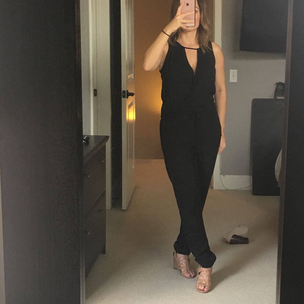 Super cute, flattering black jumpsuit! Small