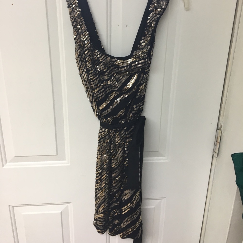 Black and gold sequin dress