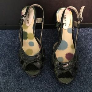 Black patten leather pumps