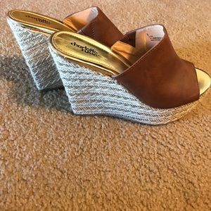 Only worn in the store! Like new tan wedges!