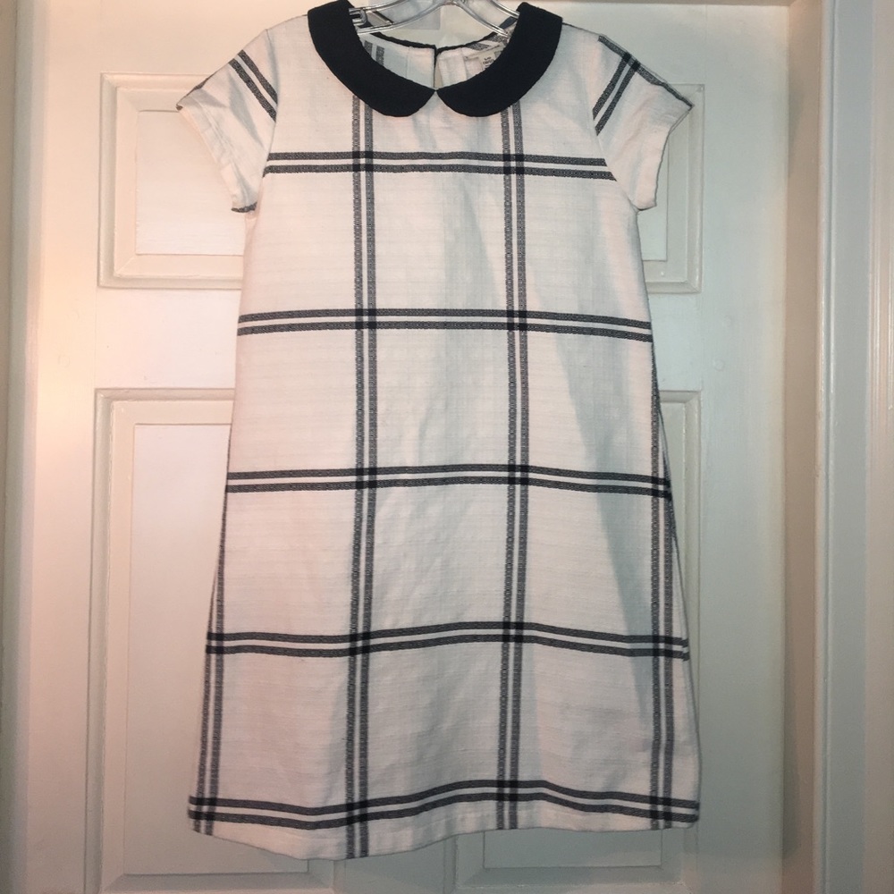 A sheath black and white dress with a black collar