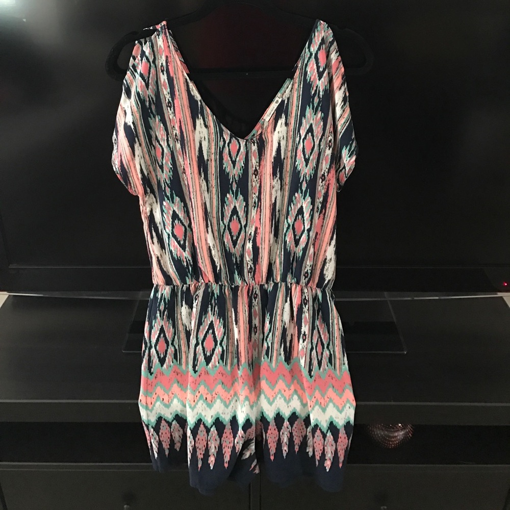 Multi colored romper NWOT! Never worn!