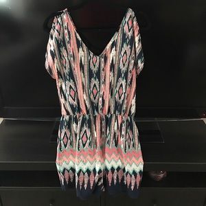 Multi colored romper NWOT! Never worn!