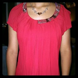 Women's Red beaded blouse with pleats.