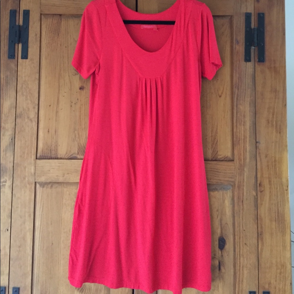 Tomato red rayon/Lycra short sleeve w/ pockets.