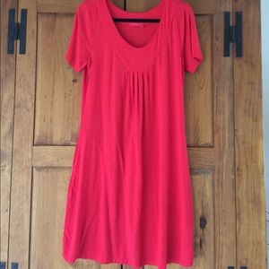 Tomato red rayon/Lycra short sleeve w/ pockets.
