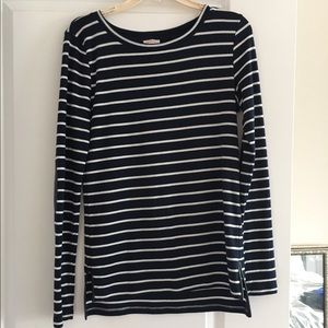 Navy and white stripped shirt, black elbow pads